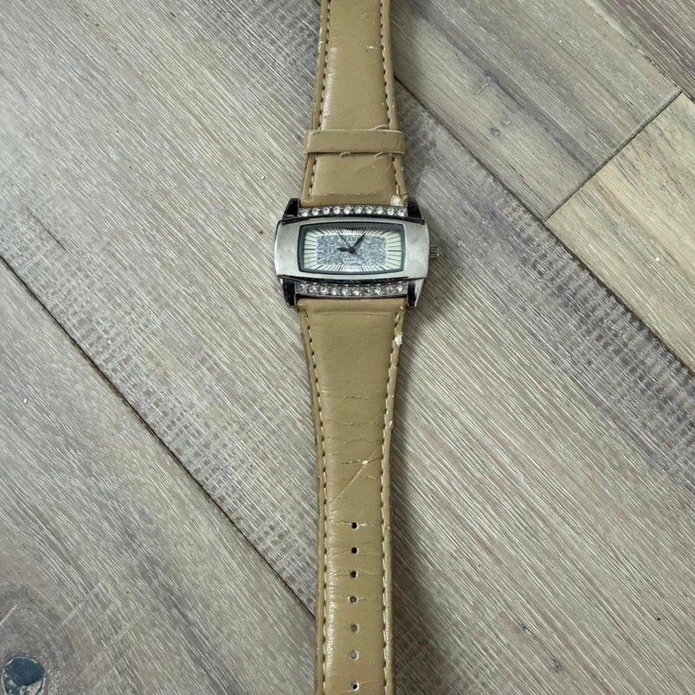 Tan leather watch with silver accents